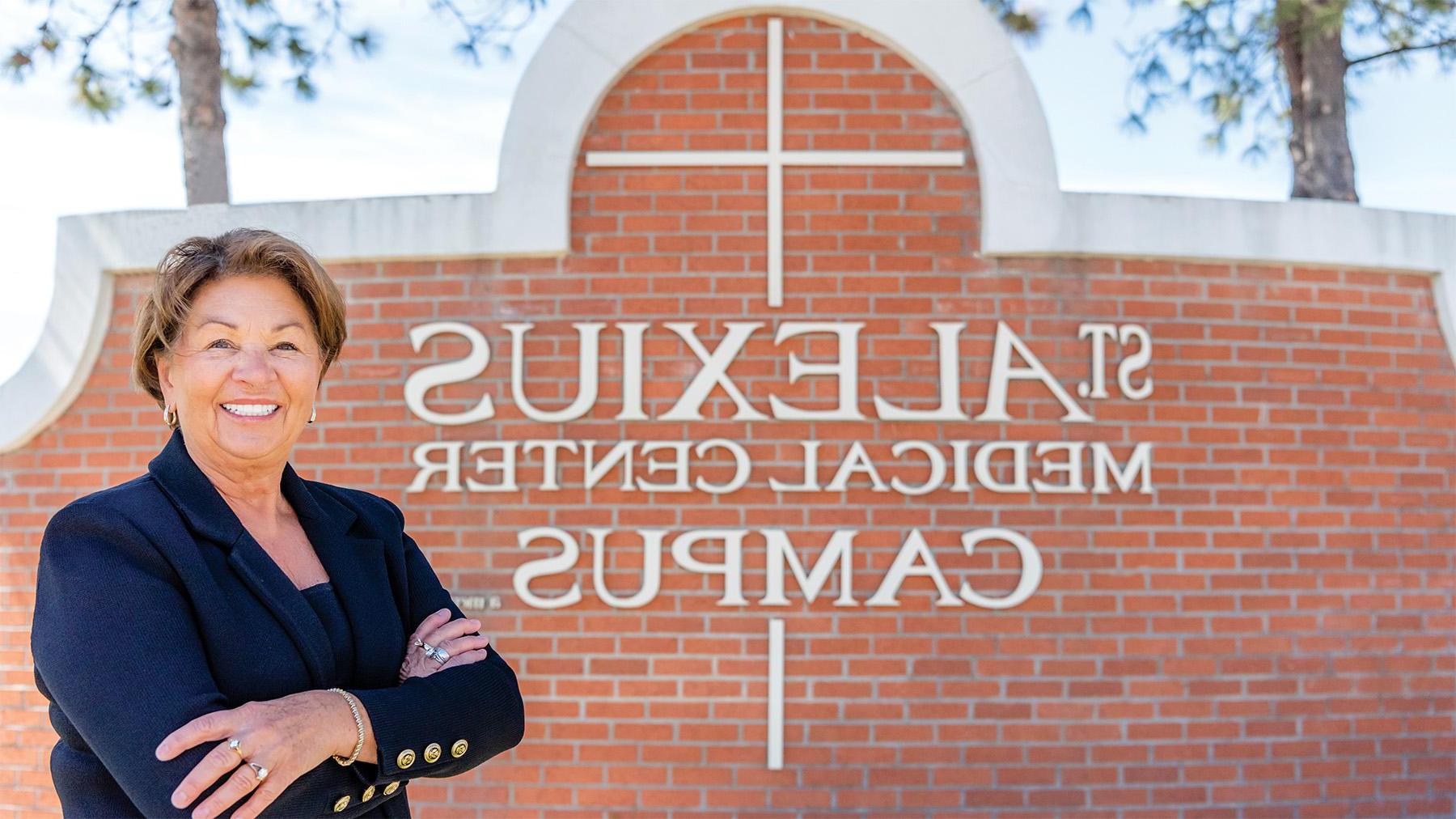 Linda Knodel's Headshot in front of St. Alexius Sign.